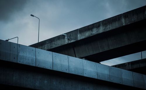 Low angle view of elevated road against sky