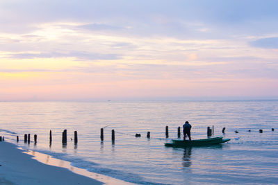 Scenic view of sea against sky during sunset