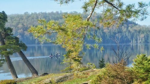 Scenic view of lake against cloudy sky