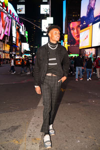 Low section of man standing on street