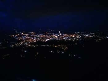 Aerial view of illuminated city at night