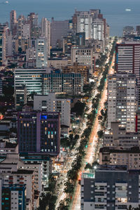 Illuminated buildings in city at night