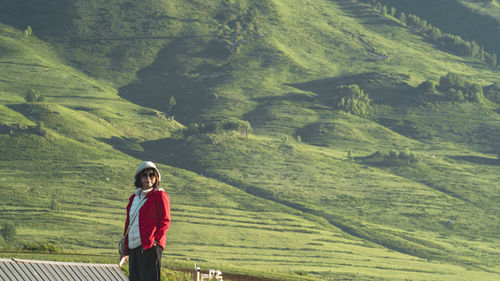 Rear view of man walking on mountain