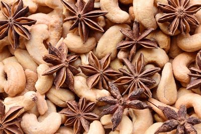 Full frame shot of salted cashews and star anises