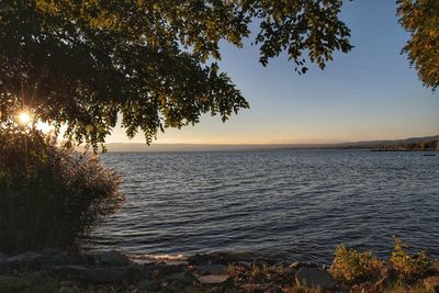 Scenic view of sea against sky at sunset