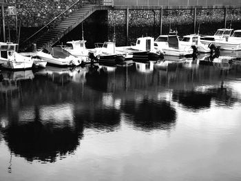 Boats moored at harbor