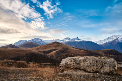 Scenic view of snowcapped mountains against sky