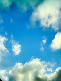 Low angle view of clouds in blue sky