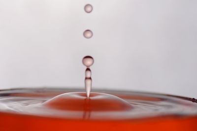 Close-up of drop splashing on water
