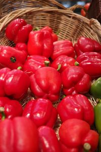 Close-up of red tomatoes in basket for sale