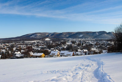 Scenic view of snowcapped mountains against sky during winter