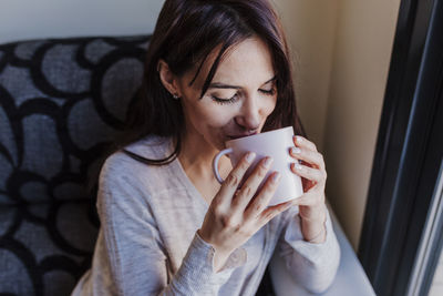 Close-up of a woman drinking coffee
