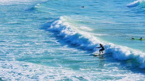 High angle view of man surfing in sea