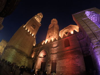 Low angle view of illuminated building at night