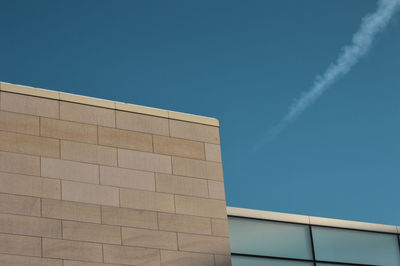 Low angle view of building against blue sky