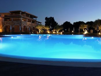 View of swimming pool at night