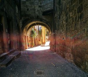Narrow alley along built structures
