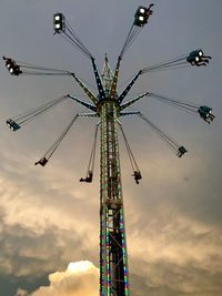 Low angle view of chain swing ride against sky