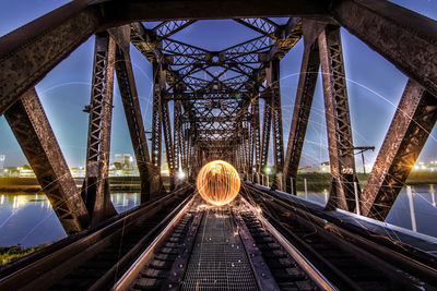 Close-up of bridge against sky in city