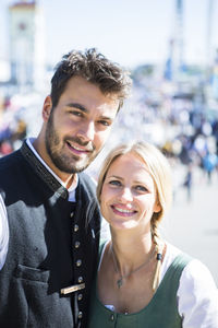 Portrait of smiling man and woman at event