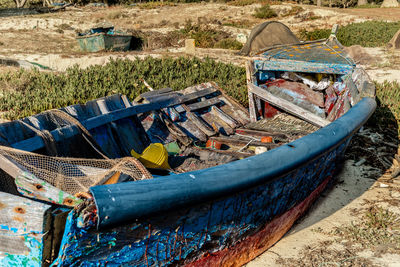 Old boat moored on beach