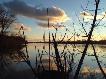 Reflection of clouds in lake at sunset