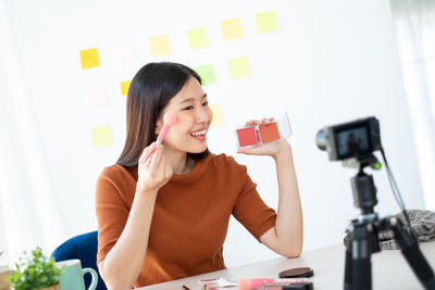 Young woman using mobile phone