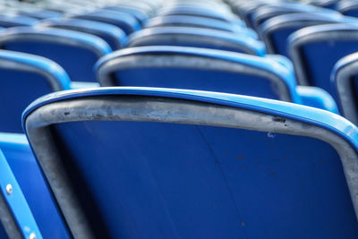 Full frame shot of blue seats in row