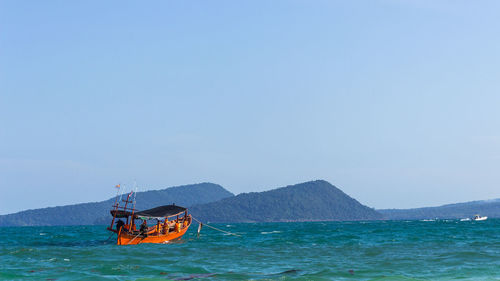 A longtail boat in the ocean at koh rong island