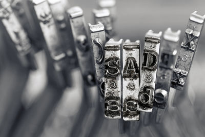 High angle view of padlocks on metal grate