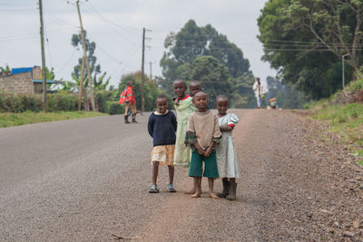 Boy standing on road