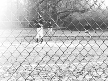 Close-up of chainlink fence against sky