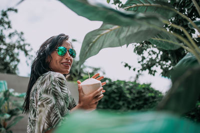 Woman holding coffee cup