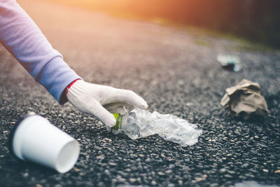 Close-up of hand holding ice cream on street