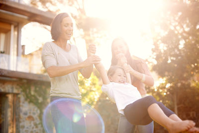 Cheerful family enjoying at lawn