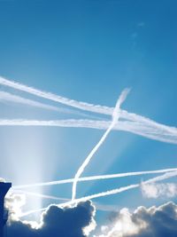 Low angle view of vapor trails in sky