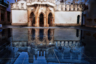 Reflection of old building in water