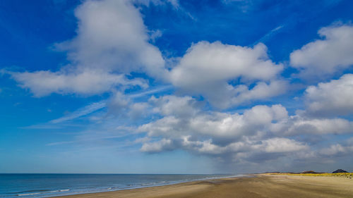 Scenic view of sea against blue sky