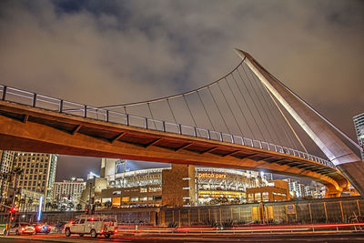 View of suspension bridge against cloudy sky