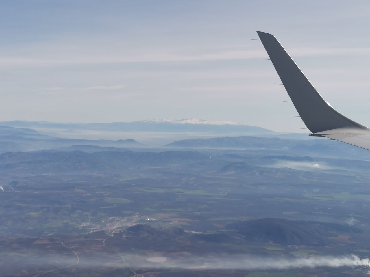 AERIAL VIEW OF MOUNTAINS AND CLOUDS