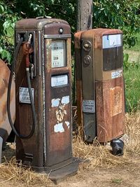 Old rusty machine on field