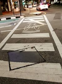 View of street crossing sign on road