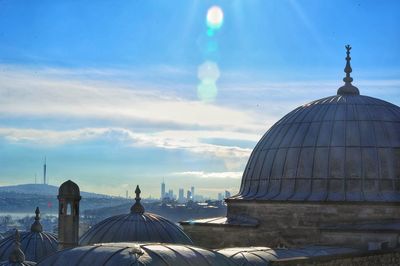 Panoramic view of buildings in city against sky