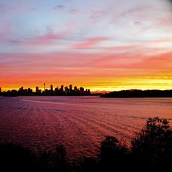 Scenic view of sunset over city