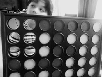 Portrait of boy holding camera