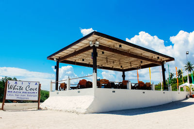 View of beach against blue sky