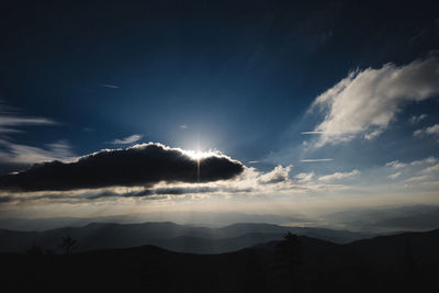 Low angle view of mountains against sky at night