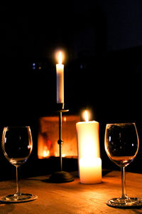 Close-up of illuminated candles on table