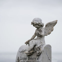 Close-up of statue against sky