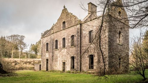 Low angle view of old building against sky